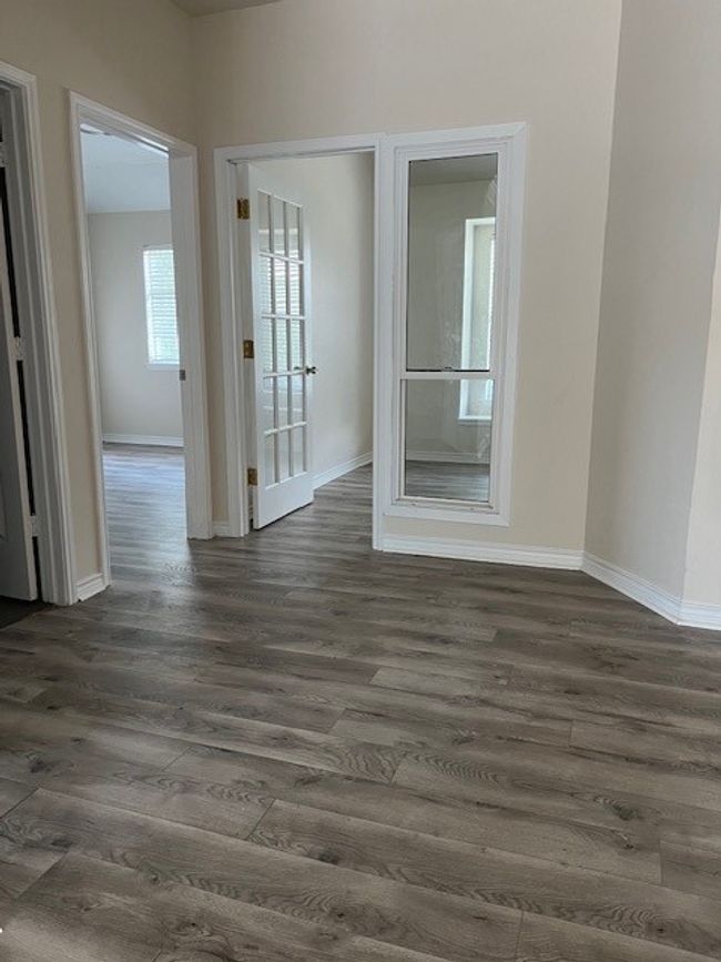 Empty room featuring dark wood-style floors and baseboards | Image 14