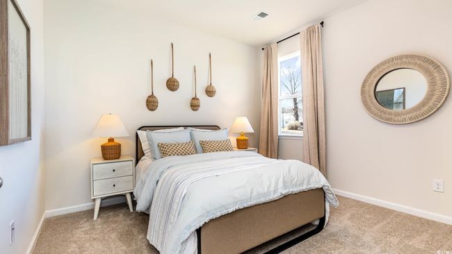 Carpeted bedroom featuring baseboards and visible vents | Image 20