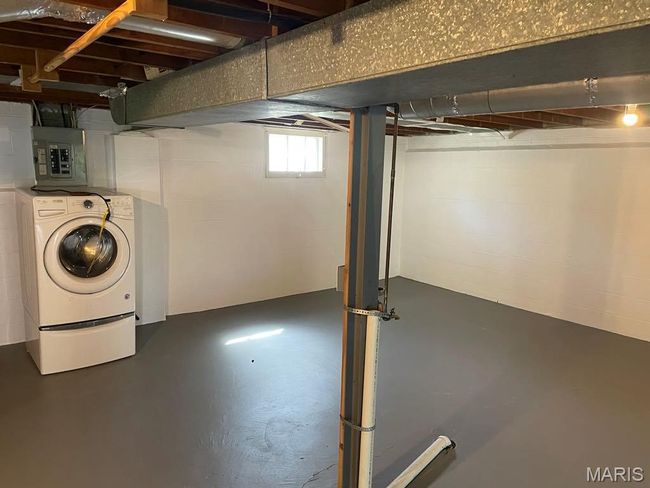 Below grade area with electric panel and independent washer and dryer | Image 24