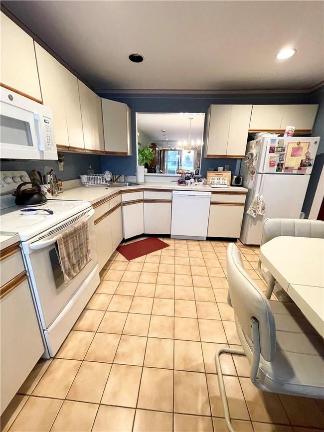 Eat in kitchen overlooking dining room. | Image 11