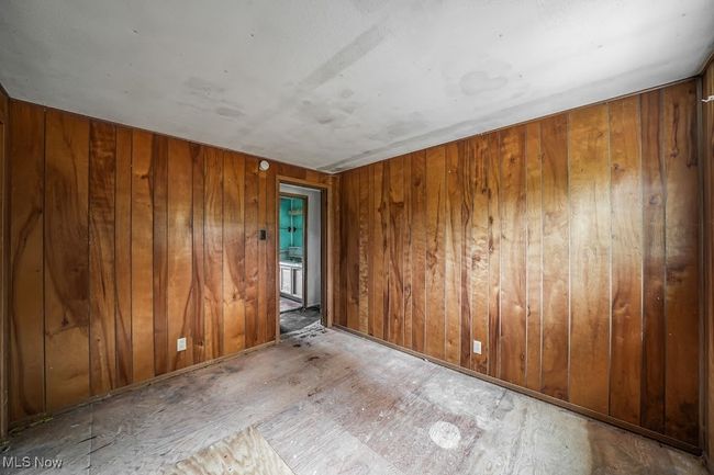 Bedroom with wooden walls | Image 4