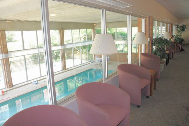 upstairs gathering room overlooks pool | Image 30