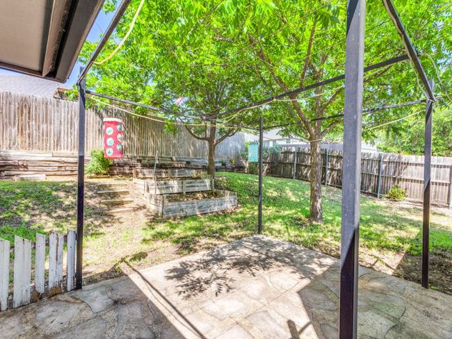 Fenced backyard featuring a patio area | Image 4