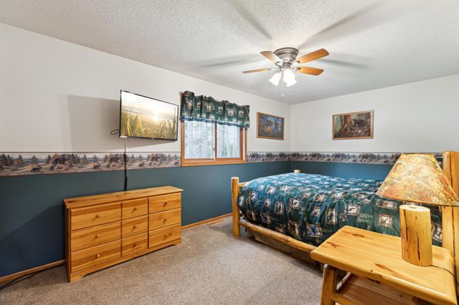 This large main level bedroom has plenty of space for large furniture. | Image 18