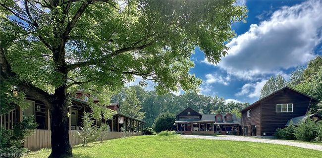 This property offers a Main House with adjoining Guest Quarters, Full Living Quarters above the Garage and 5 separate studio Guest Units | Image 4