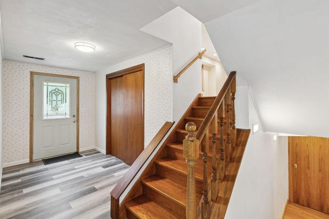 Spacious foyer with updated flooring. | Image 8