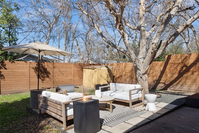 View of patio / terrace featuring an outdoor living space with a fire pit and cooling unit | Image 6