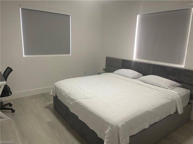 Bedroom featuring wood-type flooring | Image 2