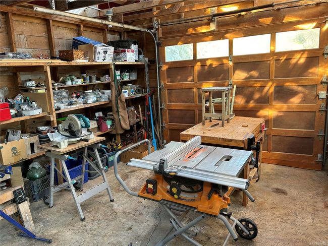 Shared - Garage with a workshop area | Image 35