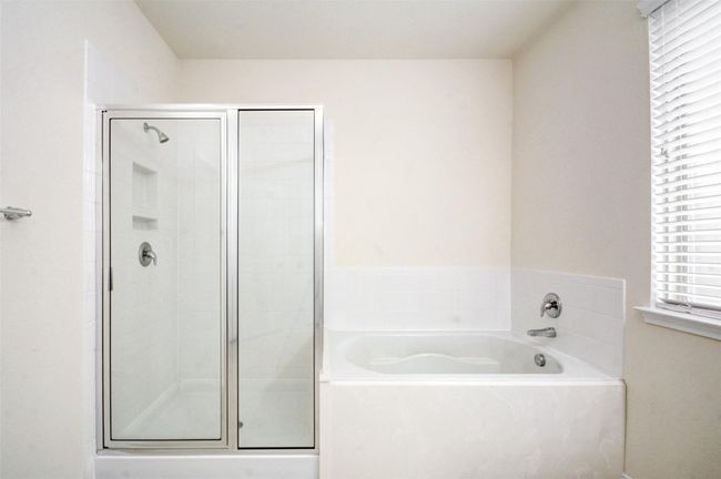 Whether you enjoy a hot shower or a long soak in the garden tub this bath has it all. | Image 20