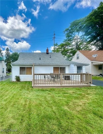 Back of house featuring a wooden deck and a yard | Image 3