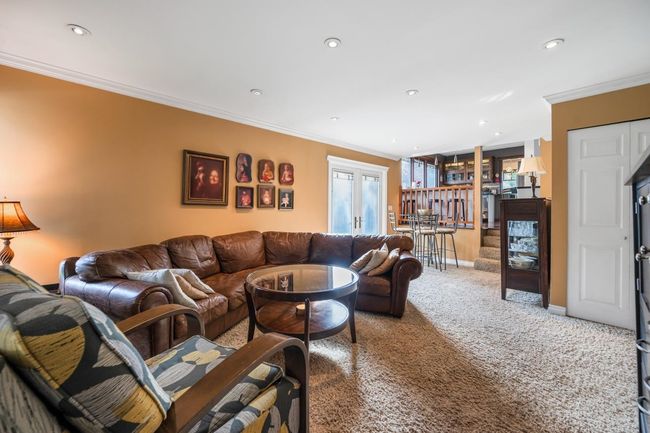 Living area featuring recessed lighting, baseboards, carpet floors, and crown molding | Image 10