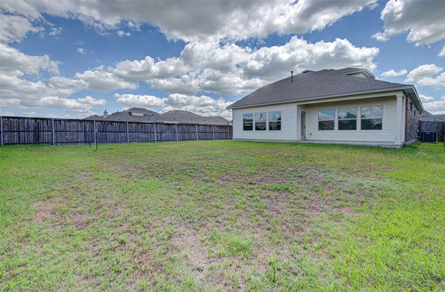 Back of house featuring central AC and roof with shingles | Image 28