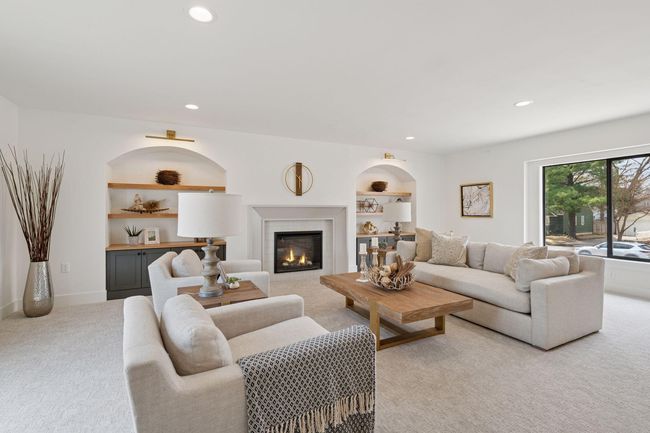 Different view of the great living area and large window overlooking the front of the home. | Image 13