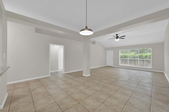 Open concept. Standing in the dining area, Living area to the right. | Image 13