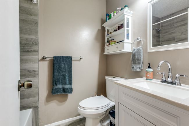 Full bathroom featuring a shower, vanity, and a tub to relax in | Image 9