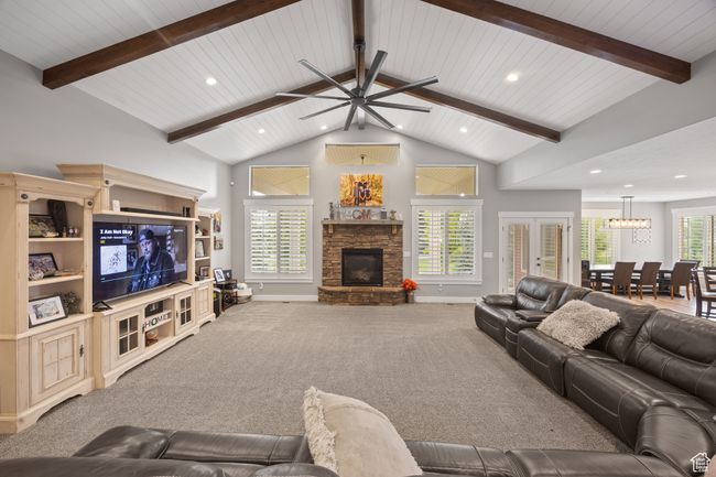 Living room featuring a fireplace, recessed lighting, ceiling fan, baseboards, and carpet flooring | Image 16