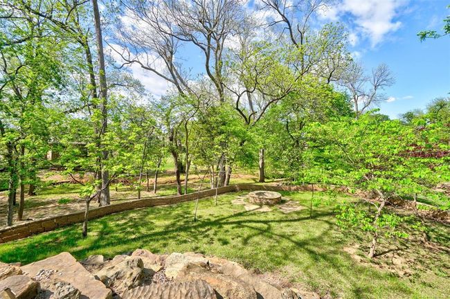 View of yard with a fire pit | Image 49