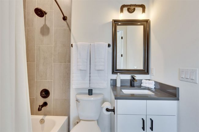 Bathroom with vanity and shower / bath combination | Image 37