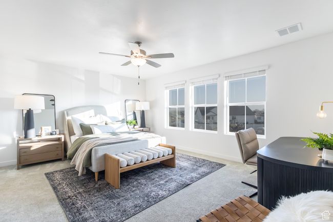 Bedroom with light carpet and a ceiling fan | Image 17