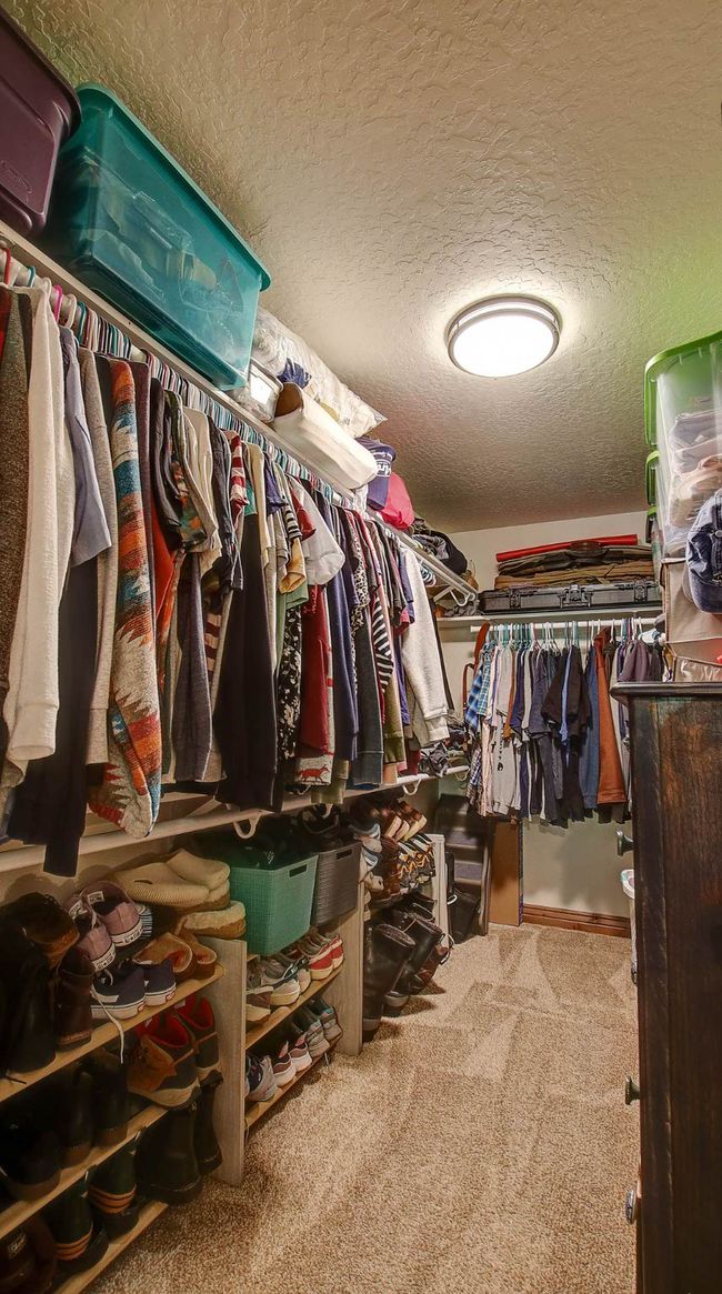 Spacious closet featuring carpet | Image 23