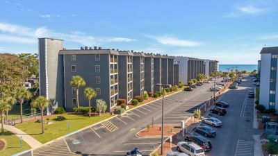 View of building exterior with a water view | Image 1