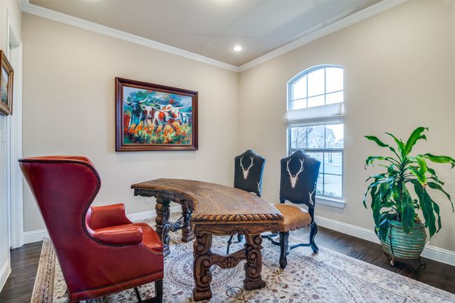 This privacy office, located off of the front entrance, has beautiful French doors. There is walk-in closet space also available in the office. | Image 8