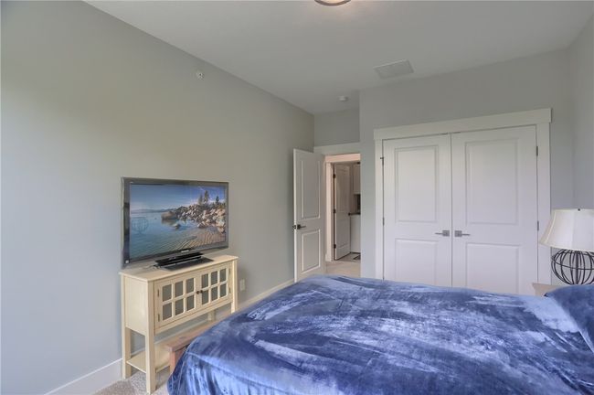 Super cute laundry room with cabinetry and floating shelf anchored on the accent wall creating a fun space to do a not so fun chore! | Image 40