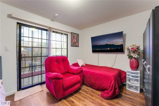 Bedroom featuring wood finished floors | Image 33