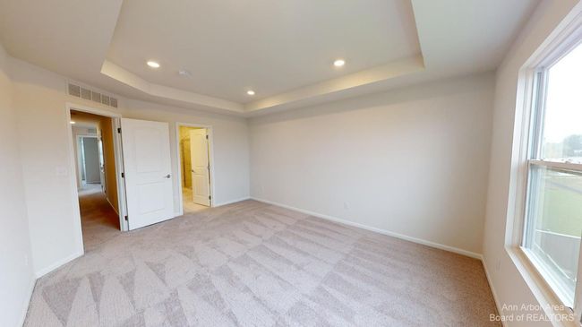 Upper level primary suite bedroom. | Image 15