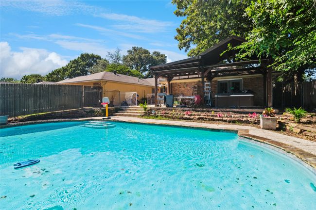 View of pool featuring a fenced backyard and a gazebo | Image 23