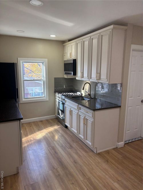 fl-2nd-132 Crossbay Blvd, Ozone Park, NY, 11417-2035 | Card Image