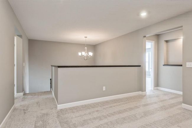 (Photo is of an inventory home, actual homes finishes will vary) Located on the upper level, this perfectly sized loft has room for a television and seating for all. Plus, it is just steps away from all 4 bedrooms. | Image 11