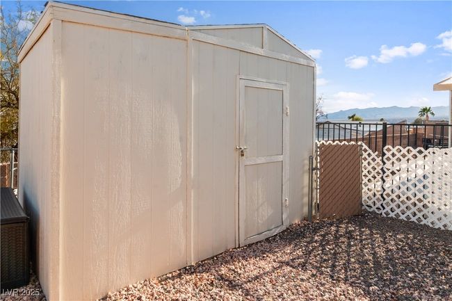 View of shed featuring fence and a mountain view | Image 37