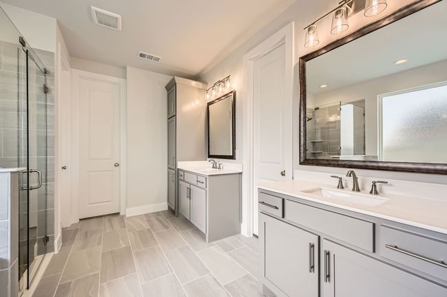 Bathroom with a shower stall, two vanities, and recessed lighting | Image 18
