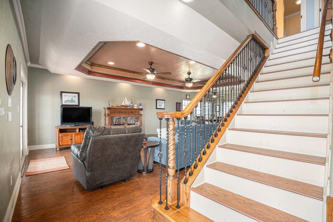 Detailed staircase with intricate wood and iron spindles. | Image 20
