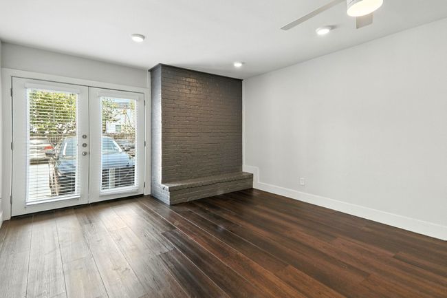 Spare room featuring dark wood finished floors, ceiling fan, french doors, and recessed lighting | Image 5