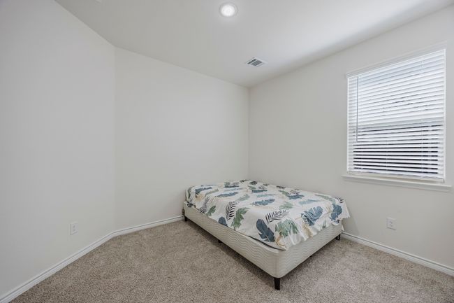 Bedroom with carpet flooring and baseboards | Image 23