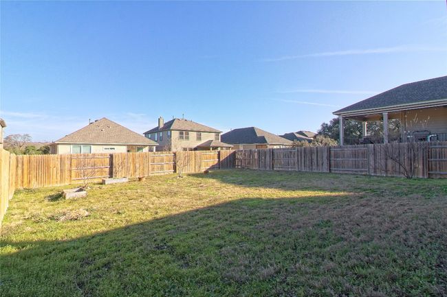 View of fenced backyard | Image 30