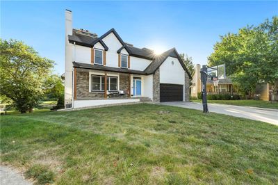 View of front facade featuring a garage and a front lawn | Image 2