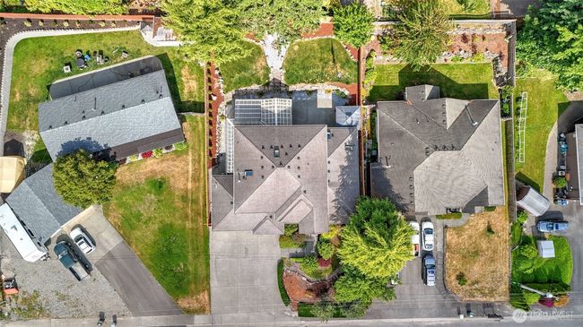 A sweeping view of the home showcases the broad driveway and beautifully maintained landscaping | Image 38