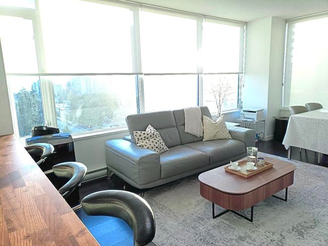 Living room featuring a baseboard radiator | Image 4