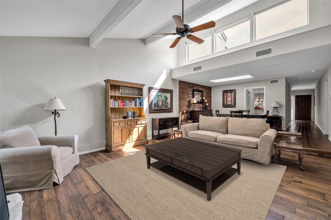 Living room with vaulted ceilings has incredible natural light and windows across the ceiling | Image 5