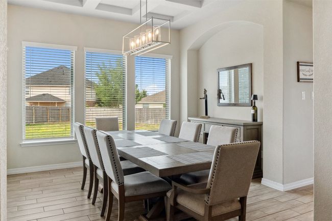 This spacious dining room is perfect for hosting memorable meals, with its abundant natural light and stylish details | Image 6