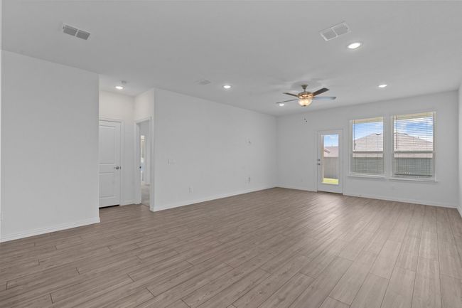 Unfurnished room with ceiling fan, light wood-type flooring, and recessed lighting | Image 10