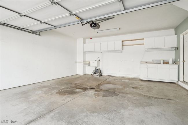 Garage featuring a garage door opener | Image 21