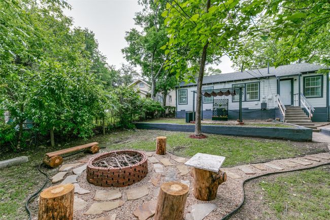 View of yard with an outdoor fire pit | Image 23