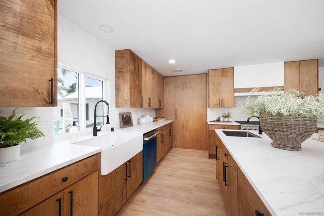 Custom hand built cabinets and porcelain backsplash along with upgraded appliances are the highlights of this kitchen | Image 16