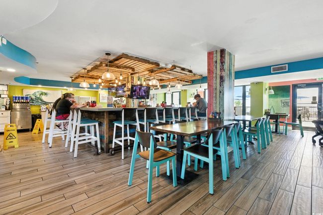Dining area with wood finished floors | Image 24