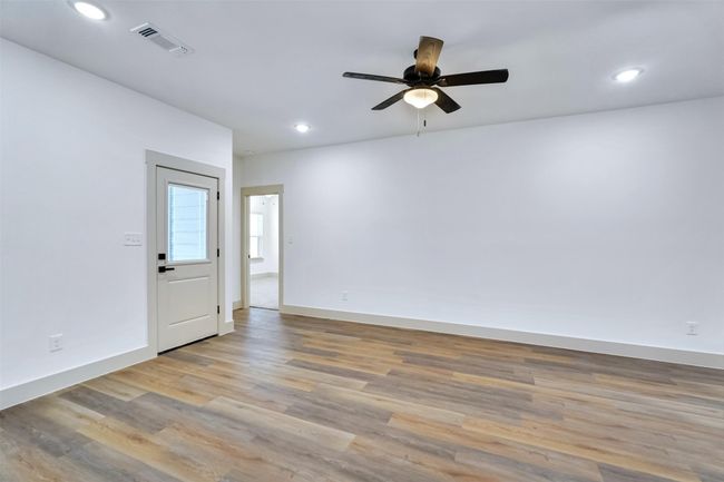Unfurnished room with recessed lighting, visible vents, a ceiling fan, and light wood-style flooring | Image 17